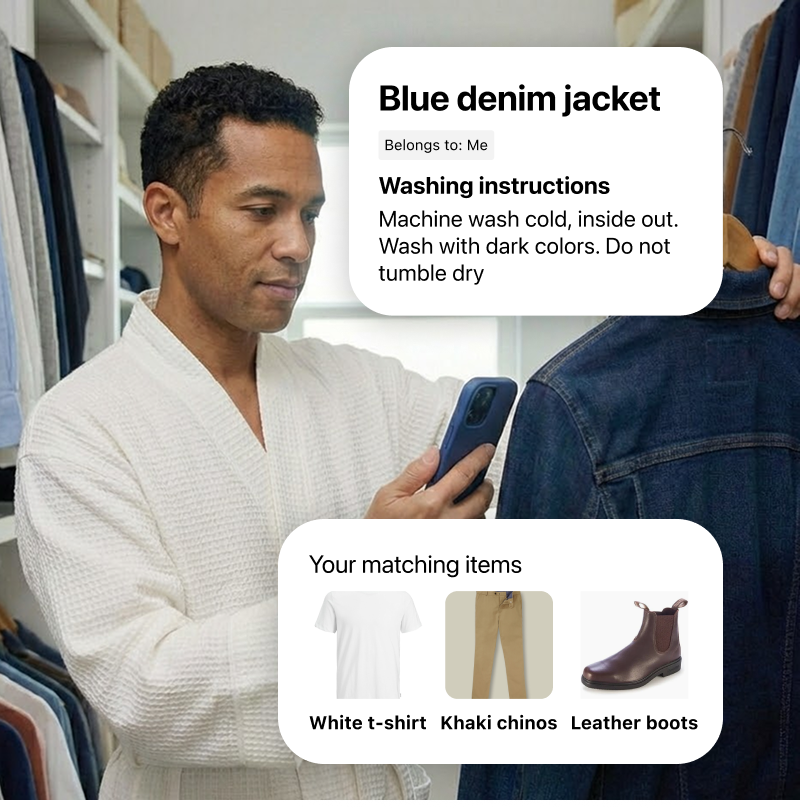 A man in his closet scans a denim jacket using his smartphone. The app overlay reads: Blue denim jacket. Belongs to: Me. Washing instructions: Machine wash cold, inside out. Wash with dark colors. Do not tumble dry. A second overlay shows your matching items: White t-shirt, Khaki chinos, and Leather boots.