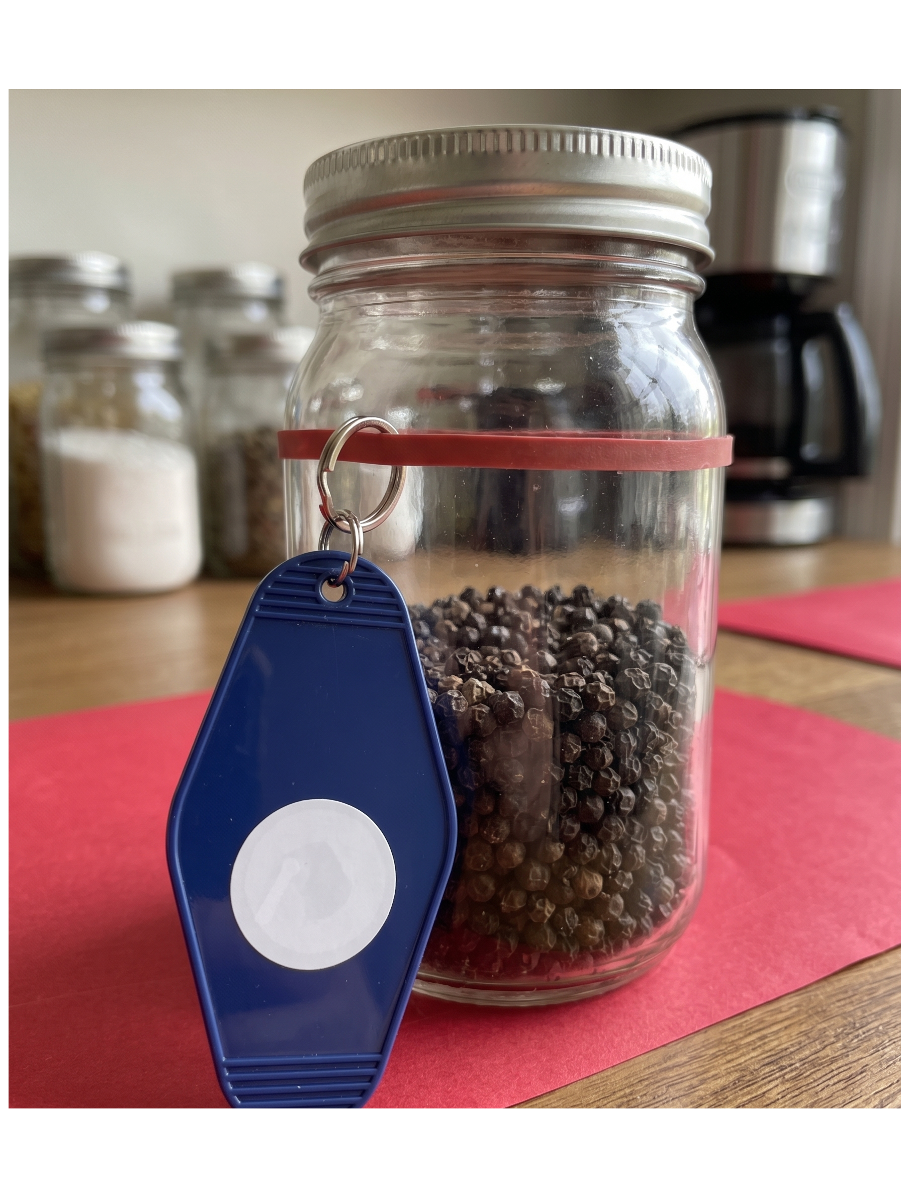 Tie-on EveryTag tied to a jar of peppercorns.